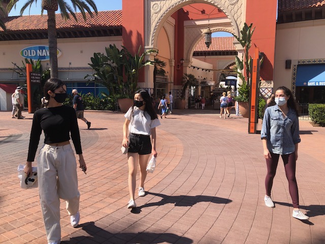 Friends hanging out safely at Irvine Spectrum.