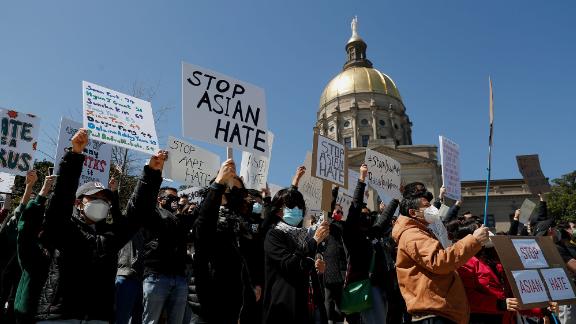 People hold placards during a "Stop Asian Hate" rally, following the deadly shootings, in Atlanta, Georgia, U.S., March 20, 2021. REUTERS/Shannon Stapleton