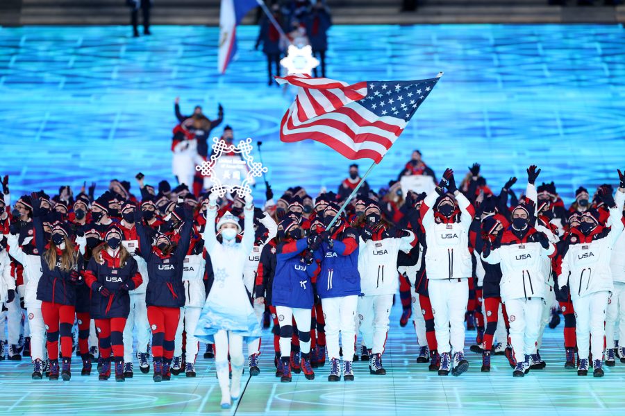 BEIJING%2C+CHINA+-+FEBRUARY+04%3A+Flag+bearers+Brittany+Bowe+and+John+Shuster+of+Team+United+States+carry+their+flag+during+the+Opening+Ceremony+of+the+Beijing+2022+Winter+Olympics+at+the+Beijing+National+Stadium+on+February+04%2C+2022+in+Beijing%2C+China.+%28Photo+by+Lintao+Zhang%2FGetty+Images%29