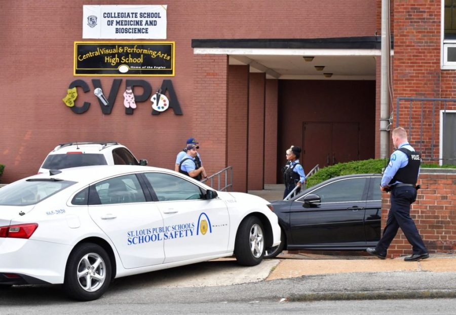 St. Louis metropolitan police officers stand outside an entrance at the northeast corner of the Central Visual and Performing Arts High School after a shooting that left three people dead including the shooter in St Louis, Missouri on October 24, 2022. - Two people were killed on Monday and several were injured by a gunman who opened fire at a high school in the midwestern US city of St. Louis, police said. (Photo by TIM VIZER / AFP) (Photo by TIM VIZER/AFP via Getty Images)