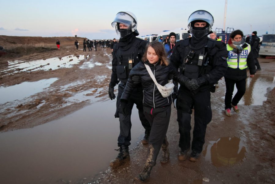 Police+officers+detain+climate+activist+Greta+Thunberg+on+the+day+of+a+protest+against+the+expansion+of+the+Garzweiler+open-cast+lignite+mine+of+Germanys+utility+RWE+to+Luetzerath%2C+in+Germany%2C+January+17%2C+2023+that+has+highlighted+tensions+over+Germanys+climate+policy+during+an+energy+crisis.+REUTERS%2FWolfgang+Rattay