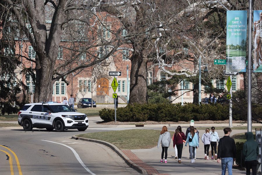 EAST LANSING, MICHIGAN - FEBRUARY 14: A police car blocks off a street on the campus Michigan State University on February 14, 2023 in East Lansing, Michigan. A gunman opened fire at two locations on the campus last night killing three students and injuring several others. (Photo by Scott Olson/Getty Images)