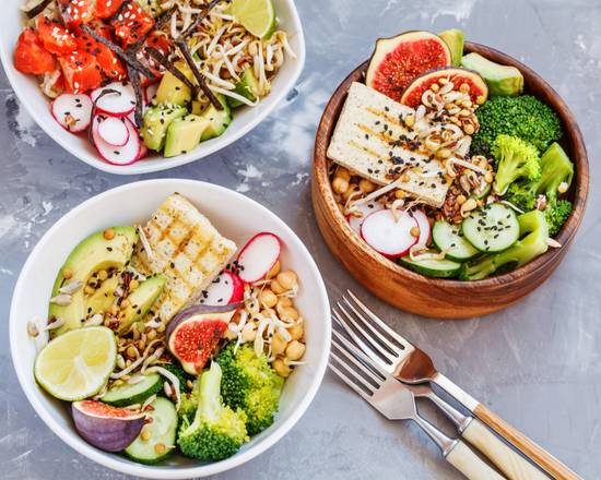 healthy lunch, buddha salad bowls, ahi poke. concrete background, healthy vegan trend food concept.