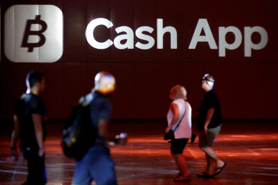 FILE PHOTO: The logo of Cash App is seen at the main hall during the Bitcoin Conference 2022 in Miami Beach, Florida, U.S. April 6, 2022. REUTERS/Marco Bello/File Photo
