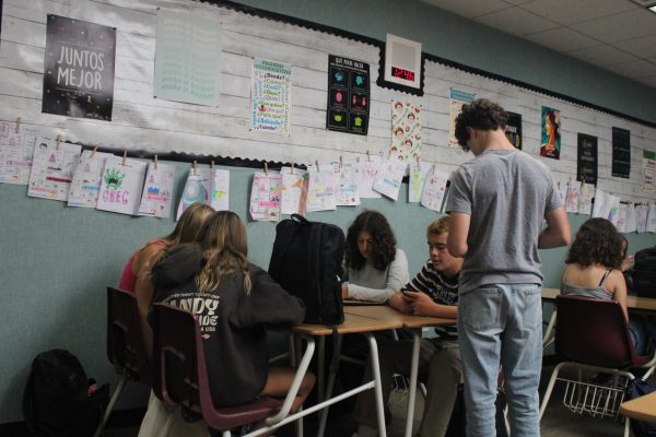 Students focused on their phones instead of socializing.