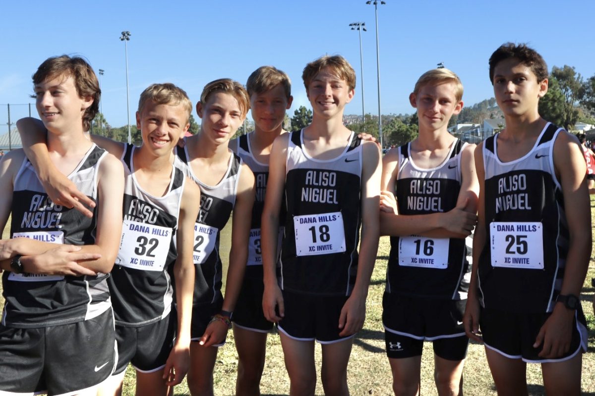 Cross country team poses for a photo before their meet.