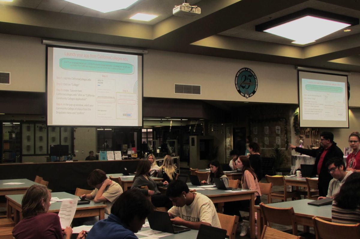 Students meet in library to learn more information about Challenge Accepted.