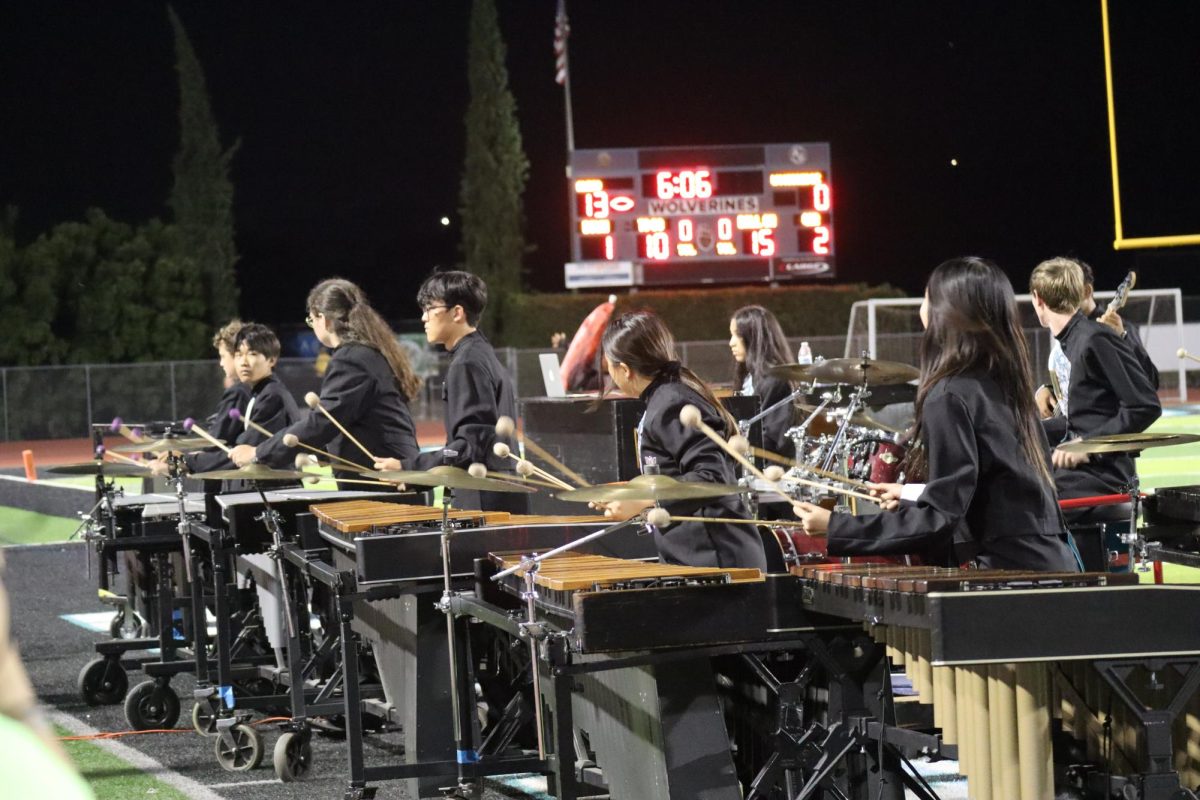 Aliso Marching band performs at a home Football game. 