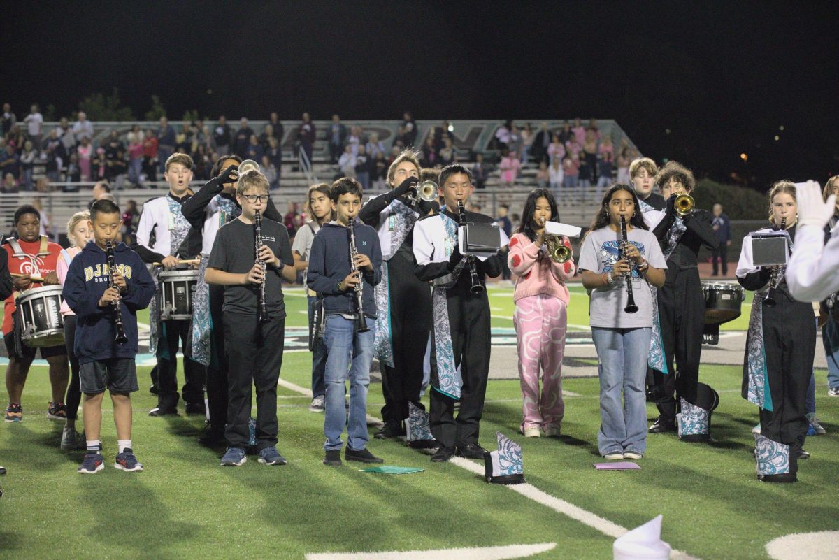 Eighth grade band students perform during halftime.