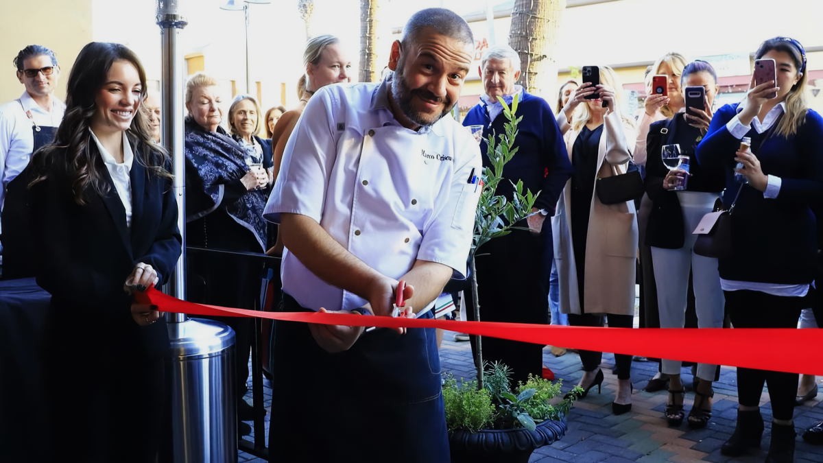   Marco Criscuolo, chef of restaurant cuts ribbon for grand opening.
Photo by: Trattoria Trullo