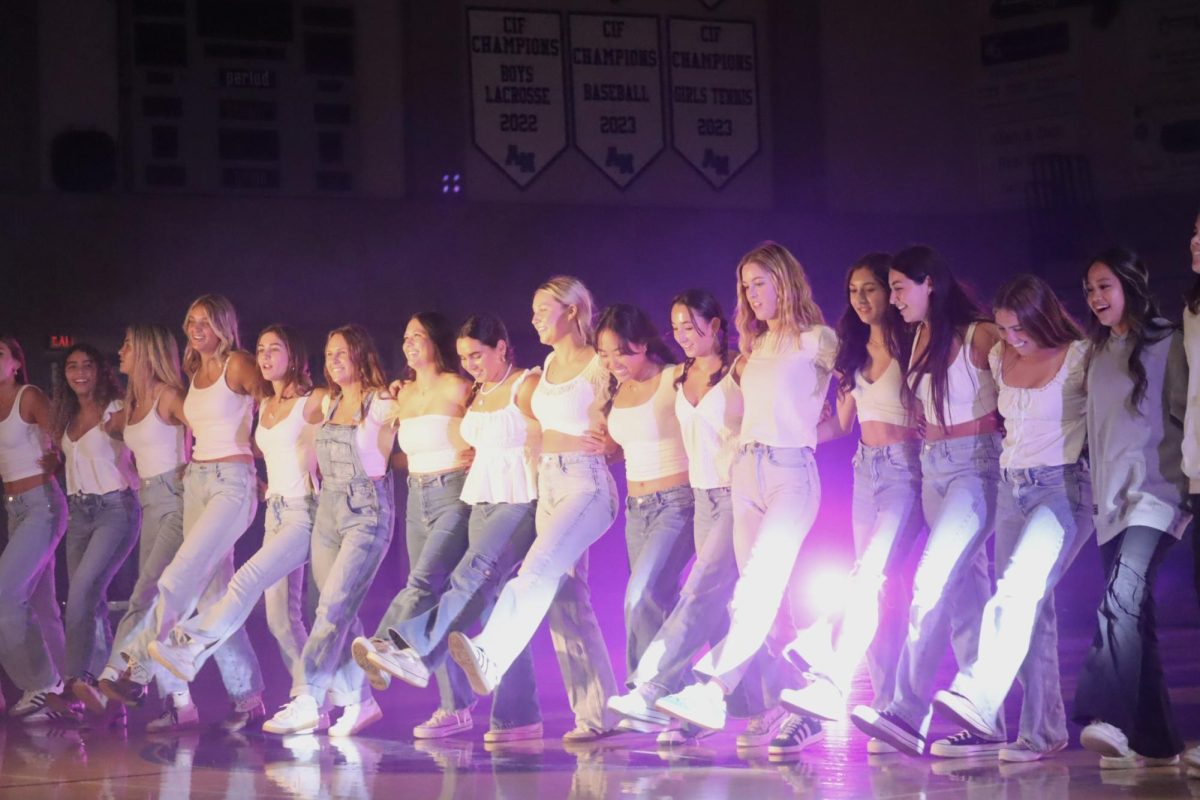 The senior girls perform a Mamma Mia themed dance in ANHS gym. 
