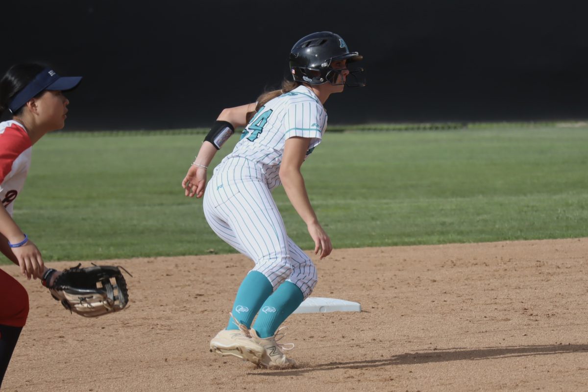 Taylor Nelson (12) on base, trying to get her team a run. 