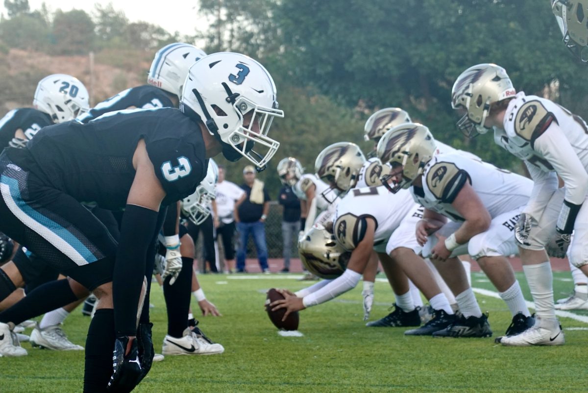 Aliso Football lines up at the start of the game. 