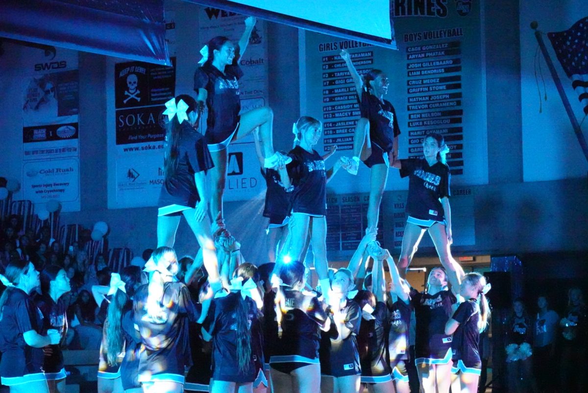 Aliso Cheer shows off their moves at the Homecoming pep rally.