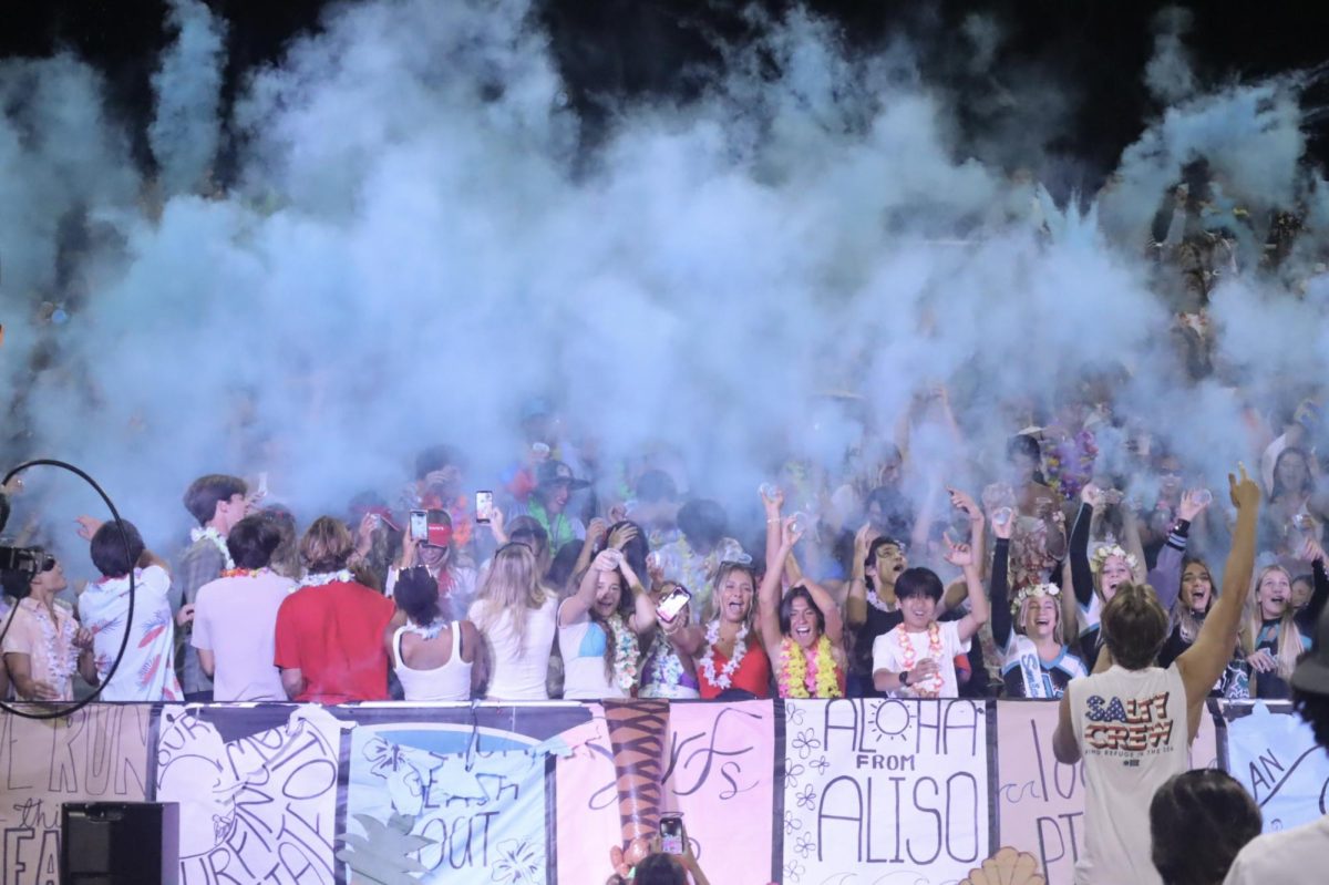 Fans support Aliso's football team in the student section.