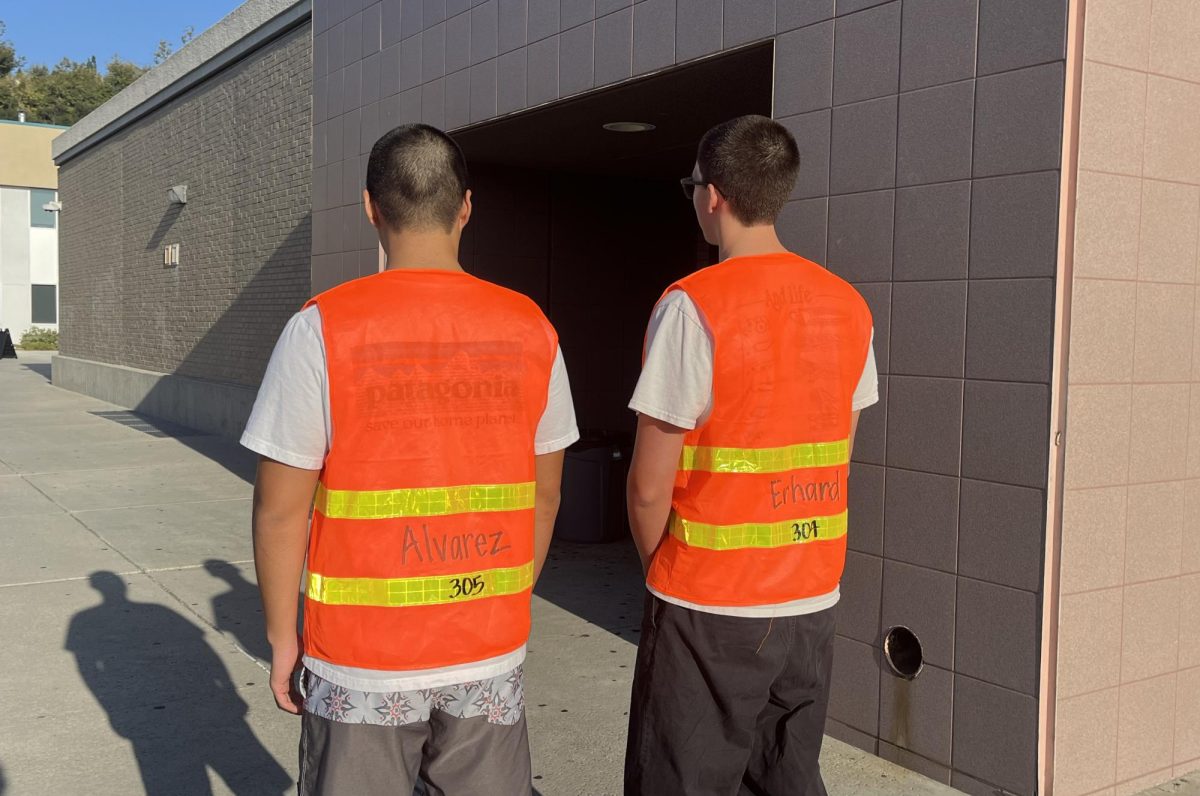 Students wear the new bathroom passes.