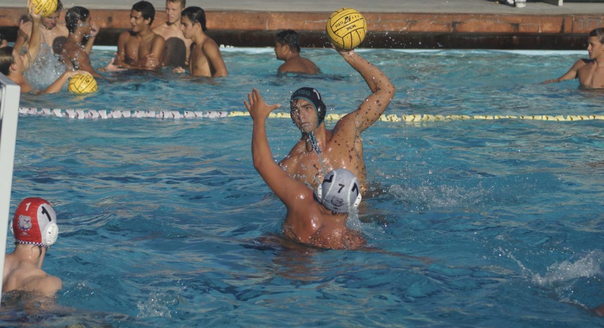 Captain Gabe Widarto (12) finishes out his final season with Aliso Boys' Water Polo.