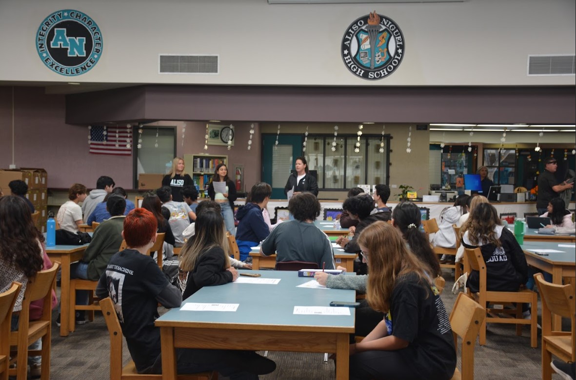 Club officers attend the ICC meeting in the library.